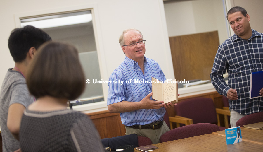 Kenneth Price, the Hillegass University Professor of American literature at Nebraska, shows part of the library's collection of Walt Whitman's work to his class.  August 23, 2016. Photo by Craig Chandler / University of Nebraska