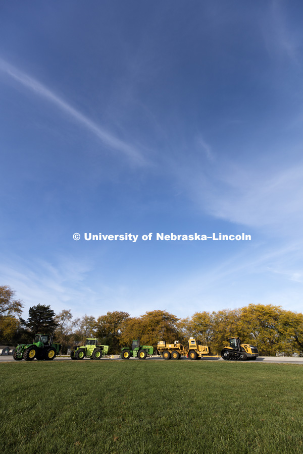 A Challenger tractor being tested pulls the test car and multiple tractors being used to provide varying amounts of drag as the tractor pulls it all around the oval test track. The University of Nebraska Tractor Test Laboratory (NTTL) is the officially designated tractor testing station for the United States. October 27, 2016. Photo by Craig Chandler / University Communication Photography.