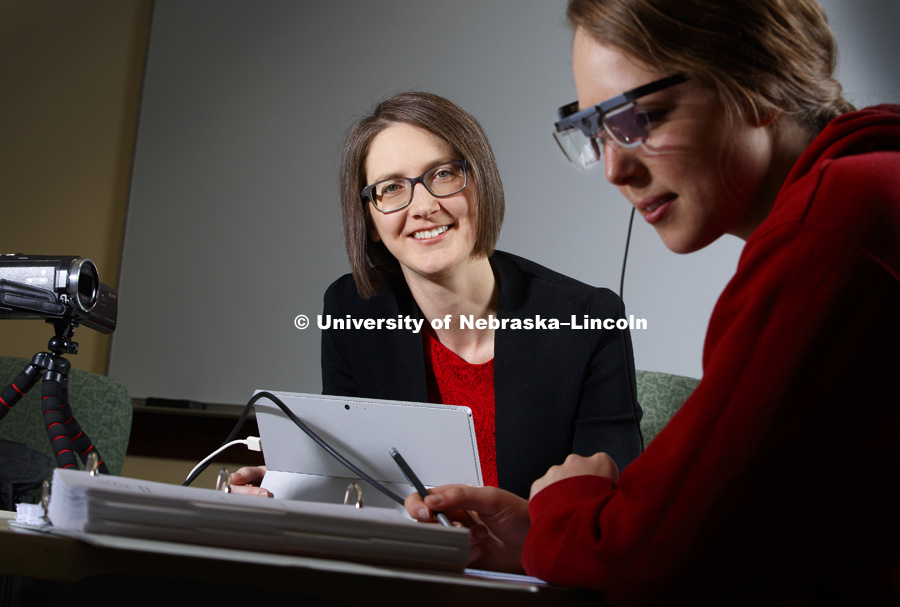 Lorraine Males, watches as Marie Foley looks at curriculum materials.  Males, an Assistant Professor in Teaching, Learning and Teacher Education, is a NSF CAREER awardee. She uses eye tracking software to research how prospective secondary mathematics