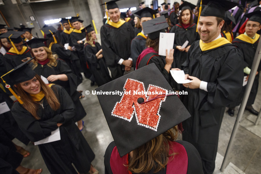 Chelsea Joekel, master's student in Speech-Language Pathology and Audiology, decorated her mortarboard with the Nebraska "N". Students earning graduate and professional degrees received their diplomas Friday afternoon in Lincoln's Pinnacle Bank Arena.