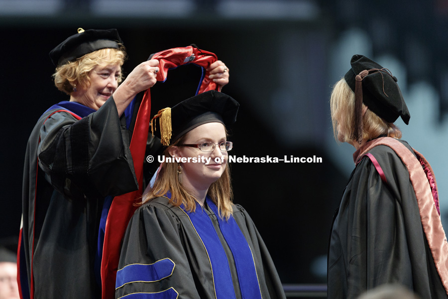 Rebecca Macijeski receives her doctoral hood Friday afternoon in Lincoln's Pinnacle Bank Arena. Undergraduate commencement is Saturday morning in the Arena. More than 3,000 degrees will be awarded May 5 and 6. May 5, 2017. Photo by Craig Chandler /