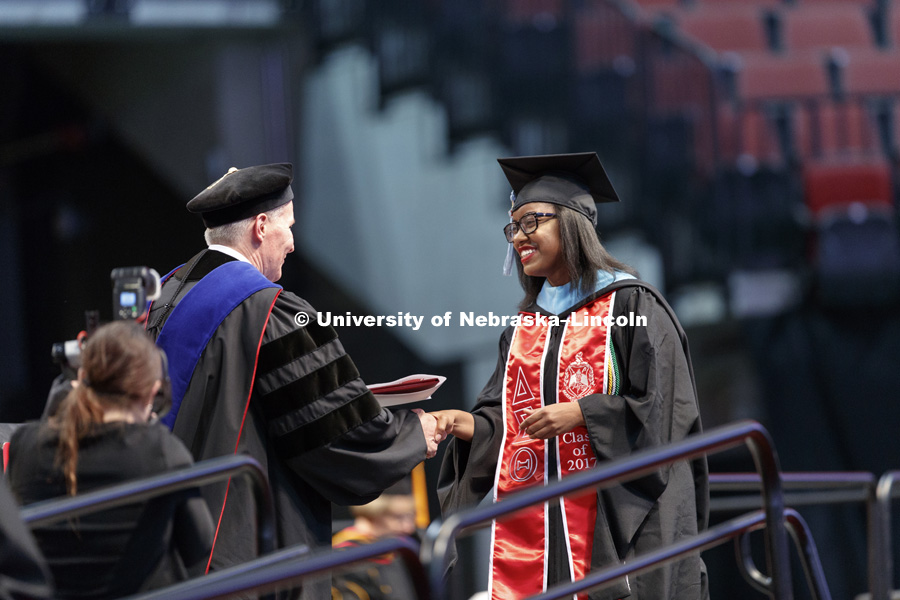 Carnetta Griffin smiles after receiving her Master's Degree. Students earning graduate and professional degrees received their diplomas Friday afternoon in Lincoln's Pinnacle Bank Arena. Undergraduate commencement is Saturday morning in the Arena. More