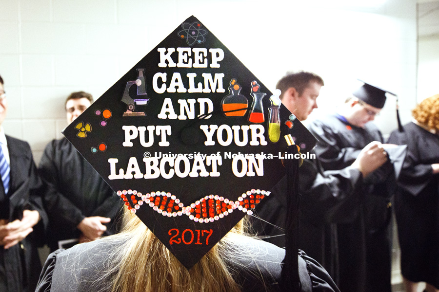 Nichole Leacock decorated her mortarboard to celebrate her Forensic Science major as part of CASNR. Students received their undergraduate diplomas Saturday morning in Lincoln's Pinnacle Bank Arena. 2452 degrees were awarded Saturday morning. May 6, 2017.
