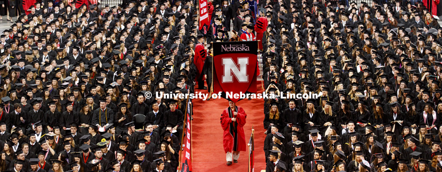 The stage party procession enters the arena after the students were seated. Students received their undergraduate diplomas Saturday morning in Lincoln's Pinnacle Bank Arena. 2452 degrees were awarded Saturday morning. May 6, 2017. Photo by Craig Chandler 