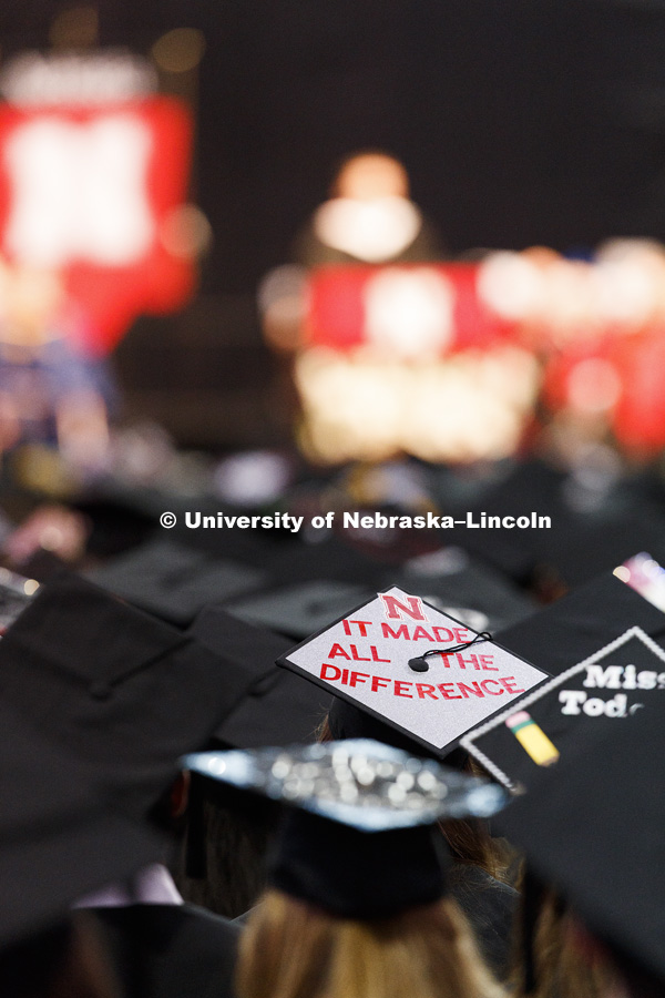 Decorated mortarboards in a sea of graduates. Students received their undergraduate diplomas Saturday morning in Lincoln's Pinnacle Bank Arena. 2452 degrees were awarded Saturday morning. May 6, 2017.  Photo by Craig Chandler / University Communication.