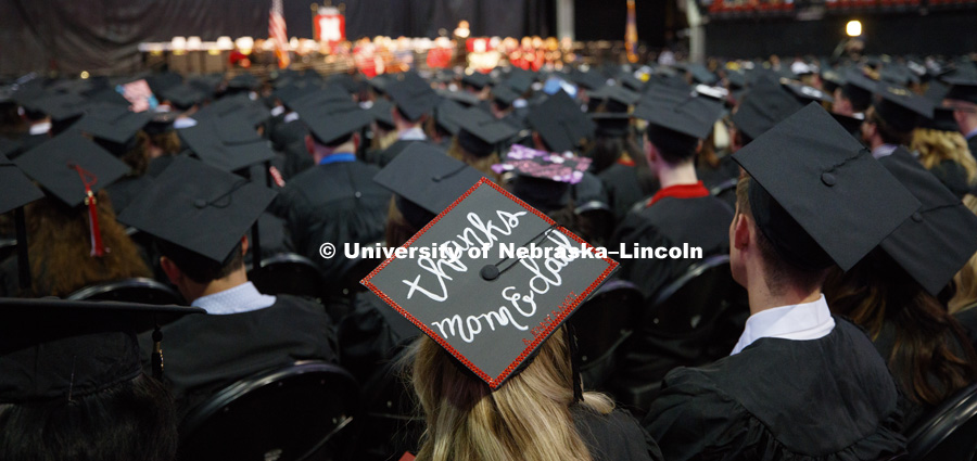 Decorated mortarboards in a sea of graduates. Students received their undergraduate diplomas Saturday morning in Lincoln's Pinnacle Bank Arena. 2452 degrees were awarded Saturday morning. May 6, 2017.  Photo by Craig Chandler / University Communication.