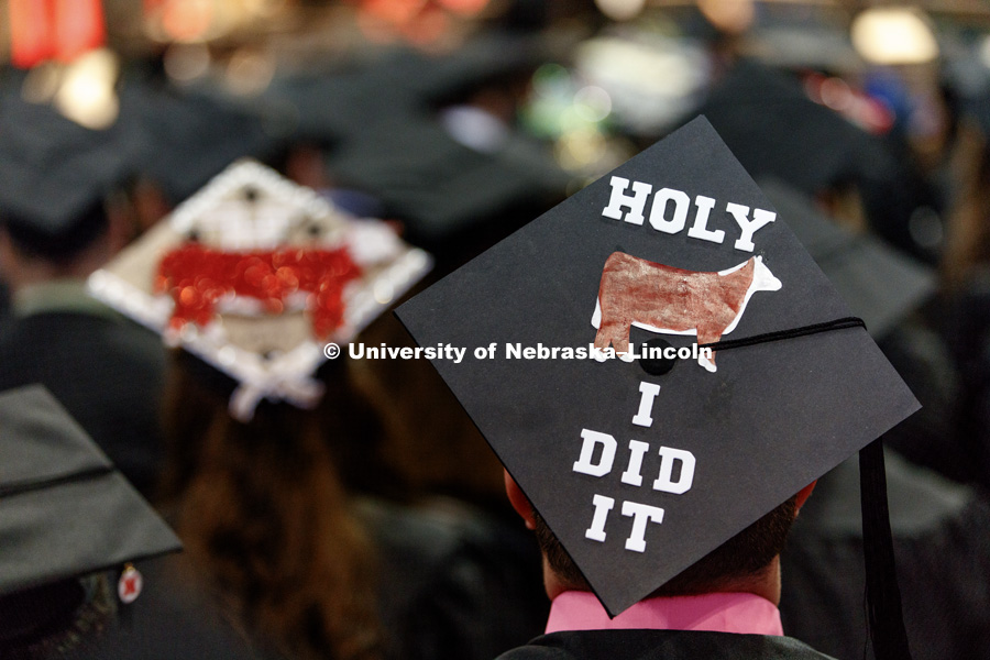 A College of Agricultural Sciences and Natural Resources graduate's decorated mortar board in a sea of graduates. Students received their undergraduate diplomas Saturday morning in Lincoln's Pinnacle Bank Arena. 2452 degrees were awarded Saturday morning.