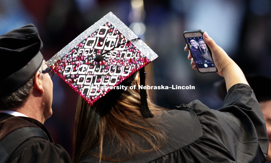 Fine and Performing Arts graduate Briannah Hunt takes a selfie with Dean Charles O’Connor after receiving her diploma. Students received their undergraduate diplomas Saturday morning in Lincoln's Pinnacle Bank Arena. 2452 degrees were awarded Saturday