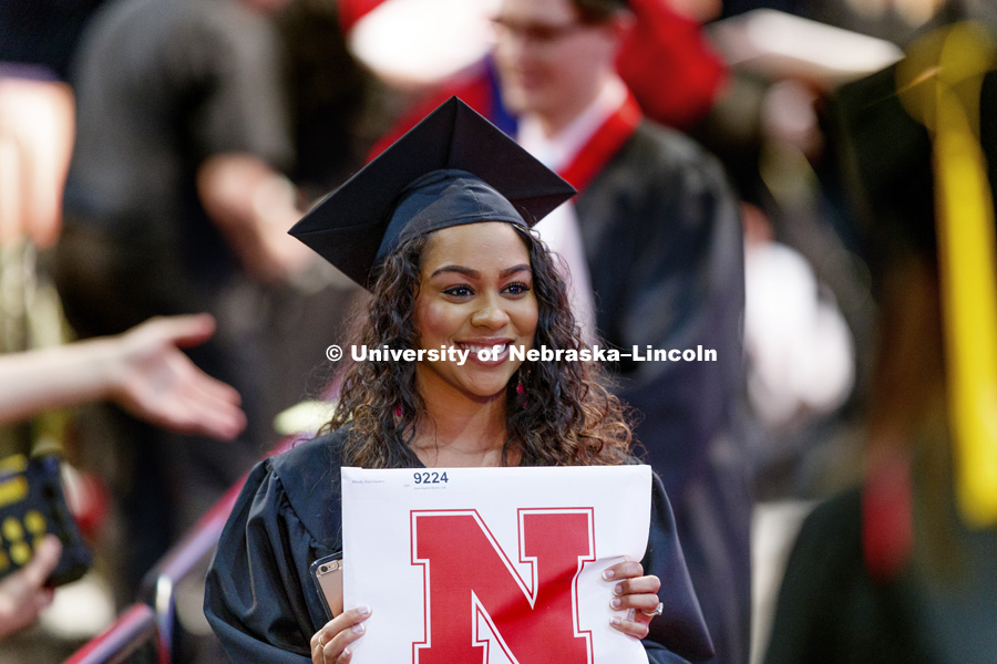 Kiara Moody shows off her College Business diploma for a photo. Students received their undergraduate diplomas Saturday morning in Lincoln's Pinnacle Bank Arena. 2452 degrees were awarded Saturday morning. May 6, 2017. Photo by Craig Chandler / University