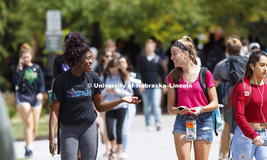 Khadiya Mengelkamp, freshman from Lincoln, and Clare Caraghar, freshman from Colorado, talk while walking on their way back from class. September 5, 2017. Photo by Craig Chandler / University Communication.