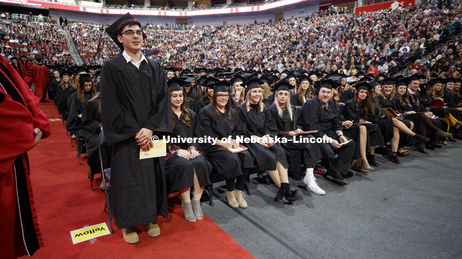 Juan Morales stands as he receives his Architecture diploma. He was the lone College of Architecture December graduate. Undergraduate Commencement at Pinnacle Bank Arena. December 16, 2017. Photo by Craig Chandler / University Communication.