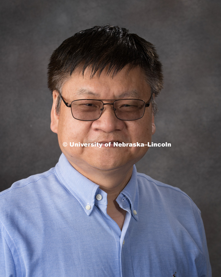 Studio portrait of Yongfeng Lu, Professor, College of Engineering. May 9, 2018. Photo by Greg Nathan, University Communication Photography.