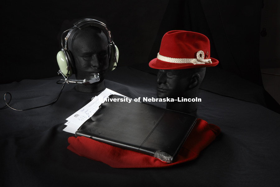 Icons of coaching legends. Pictured; Tom Osborne's headset, Bob Devaney's hat, and John Cook's clipboard. Photographed for the N150 anniversary book. May 24, 2018. Photo by Craig Chandler, University Communication.