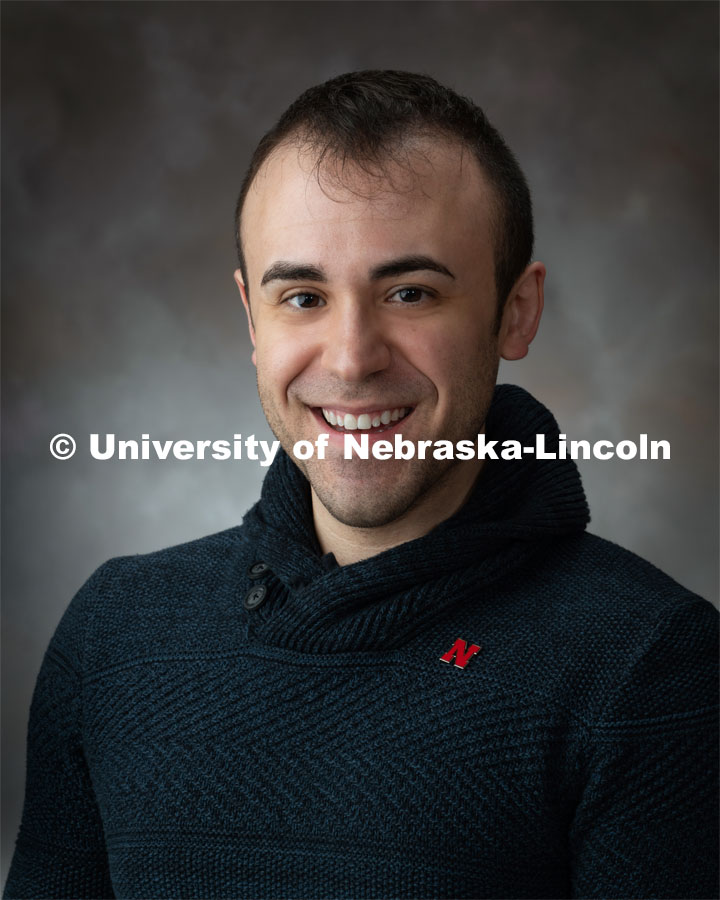 Studio portrait of Sean Lamer, Project Associate for the Bureau of Sociological Research. April 4, 2019. Photo by Greg Nathan / University Communication.