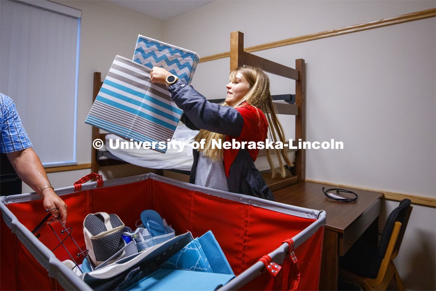 Taylor Gregory from Hooper, Nebraska, unloads her belongings into her Massengale Residential Center room. August 21, 2019. Photo by Craig Chandler / University Communication.