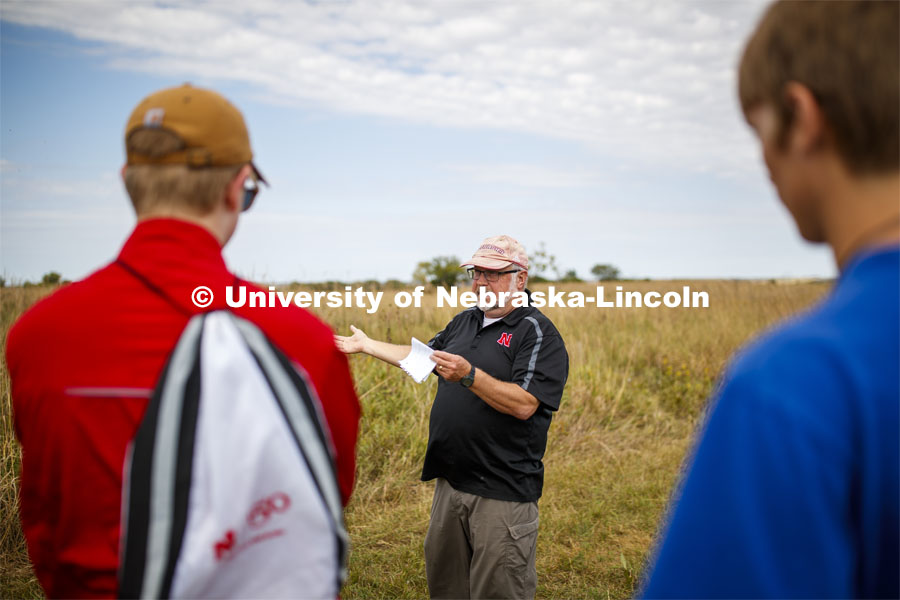 Dave Wedin talks with students. Natural Resources 101 course learns about tall grass plants and range management at Nine Mile Prairie northwest of Lincoln. September 26, 2019. Photo by Craig Chandler / University Communication.