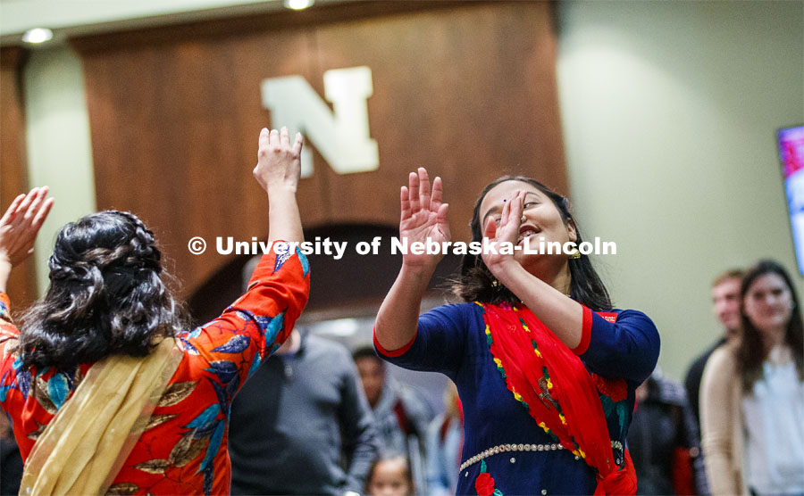 Sandhya Karki, right, and Asmita Jayswal perform a traditional Naval dance to Napalming folk song. Global Huskers Festival, a multicultural festival provides attendees the chance to explore the world through informational booths that will have food, cultural décor, art, and more, each hosted by UNL students from those culture. November 19, 2019. Photo by Craig Chandler / University Communication.