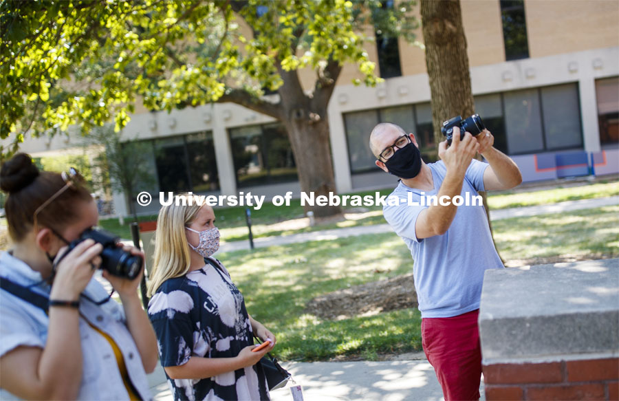 Walker Pickering explains camera settings to Rachel Lesley in the PHOT 161 - Photography for Non-majors class. City Campus. August 26, 2020. Photo by Craig Chandler / University Communication.