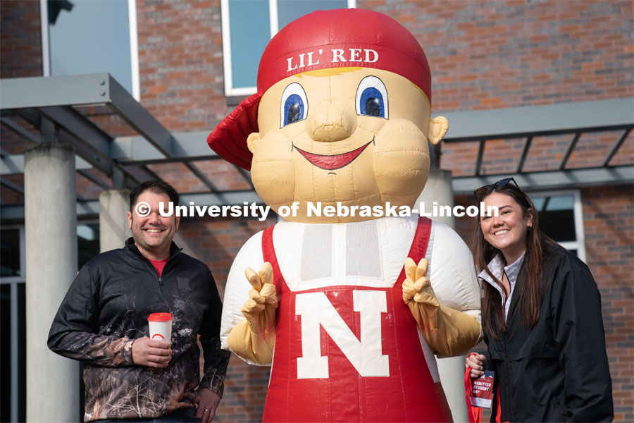 Students pose with Lil’ Red near the Van Brunt Visitor’s Center. Admitted Student Day is UNL’s in-person, on-campus event for all admitted students. March 26, 2022. Photo by Jordan Opp for University Communication.