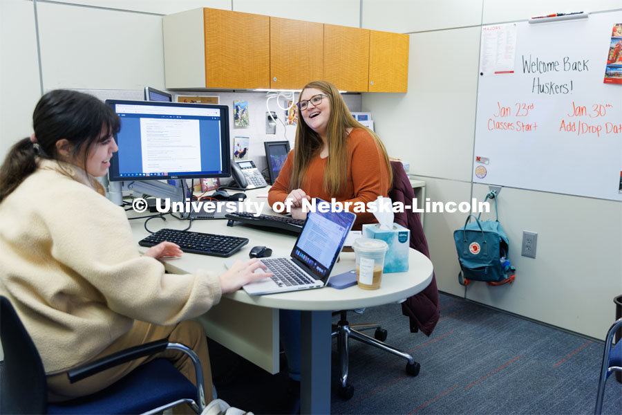 Alex Dudley, an Academic Advisor at the Explore Center helps a student. February 7, 2023. Photo by Craig Chandler / University Communication.
