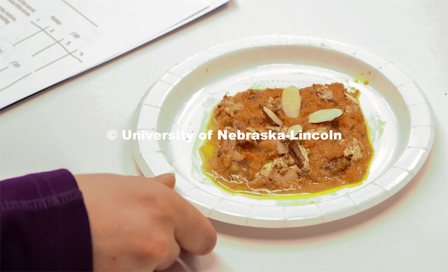 The winning entry, Great Indian Carrot Porridge, is plated and presented for the judges.

Groups prepared baked goods using flour made from crickets. Battle of the Food Scientists at Nebraska Innovation Campus. February 15, 2023. Photo by Blaney Dreifurst / University Communication.

