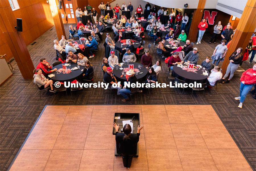 Allie Reynolds, center, speaks to out-of-state students and their families during student admission’s National Tailgate at the Wick Alumni Center. Admitted Student Day is UNL’s in-person, on-campus event for all admitted students. March 24, 2023. Photo by Jordan Opp for University Communication.