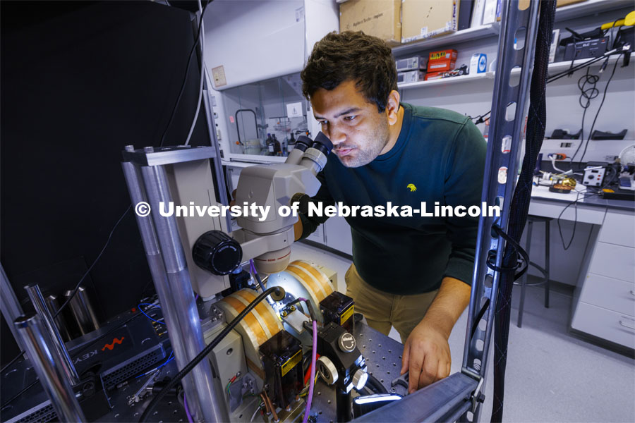 Rupak Timalsina, graduate student in engineering, works with his laser experiment in the Laraoui lab. Abdelghani Laraoui, is working to find materials that would improve the performance of quantum computing. To do this, they need to create an environment that is super cold – talking close to zero Kelvin. Laraoui said the NSF money, in part, is helping to fund the purchase of a state-of-the-art MRI that creates such cold environments. It would make UNL one of the few places in the US that this type of research could take place. October 12, 2023. Photo by Craig Chandler / University Communication.