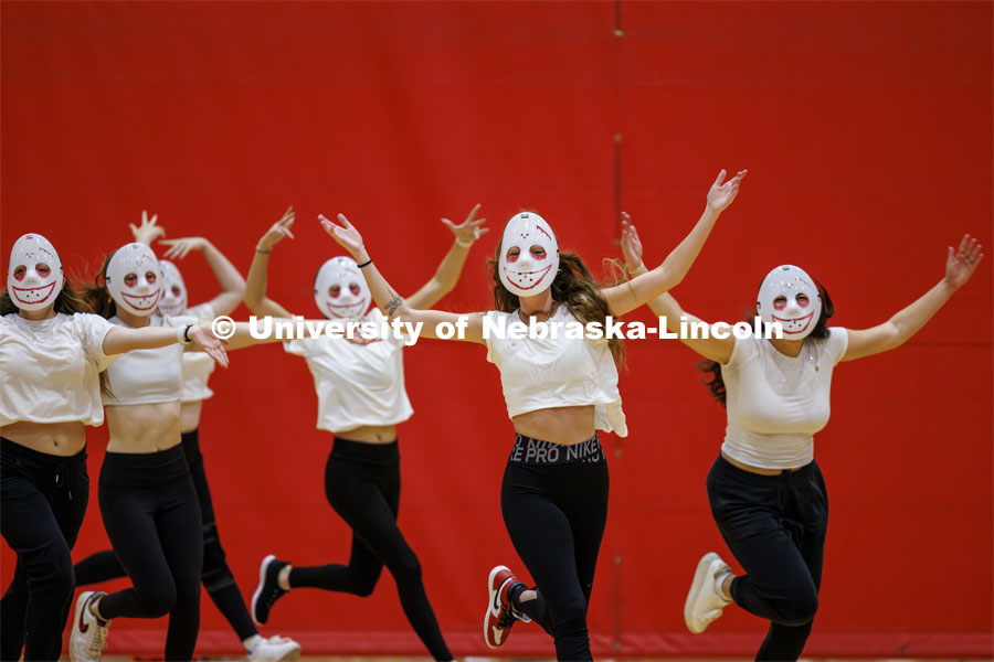 Team 12: Beta Theta Pi, Theta Chi, Delta Delta Delta, Pi Alpha Chi perform wearing white masks. Showtime at the Coliseum. Recognized Student Organizations, Greeks and Residence Halls battle against each other with performances for Homecoming competition points and ultimate bragging rights. Homecoming 2023. October 23, 2023. Photo by Craig Chandler / University Communication.