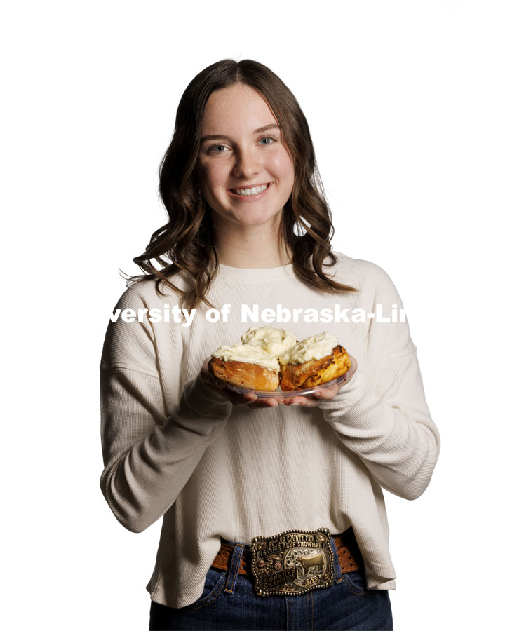 Alexa Carter, a freshman in agricultural leadership, education and communication and an Engler Agribusiness Entrepreneur. holds her “Chili Rolls,” a treat that joins the sweet and savory majesty of the Midwest’s legendary chili and cinnamon rolls. November 29, 2023. Photo by Craig Chandler / University Communication and Marketing.