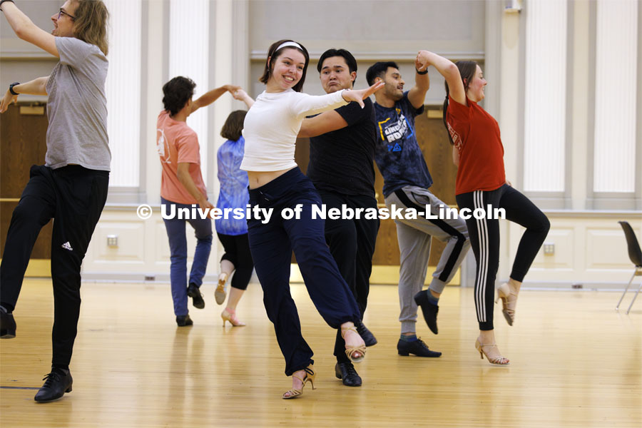 Grace Thomsen and Calen Bernbeck do a quick-step dance with the gold group. Ballroom Dancing Club works through their final practice in the Nebraska Union Ballroom Thursday night before Saturday’s show. December 7, 2023. Photo by Craig Chandler / University Communication and Marketing.