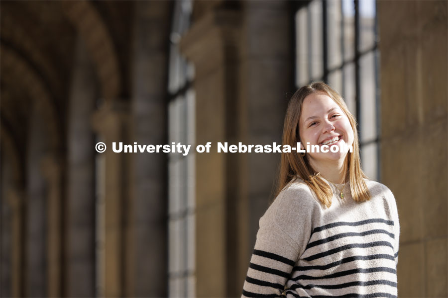 Francie Heeren, junior in political science and ethnic studies, attends UNL with a scholarship from The Nebraska Promise program. The program covers undergraduate tuition at the University of Nebraska's four campuses (UNK, UNL, UNMC and UNO) and its two-year technical college (NCTA). Heeren is photographed in different areas of the State Capitol. December 13, 2023. Photo by Craig Chandler / University Communication and Marketing.