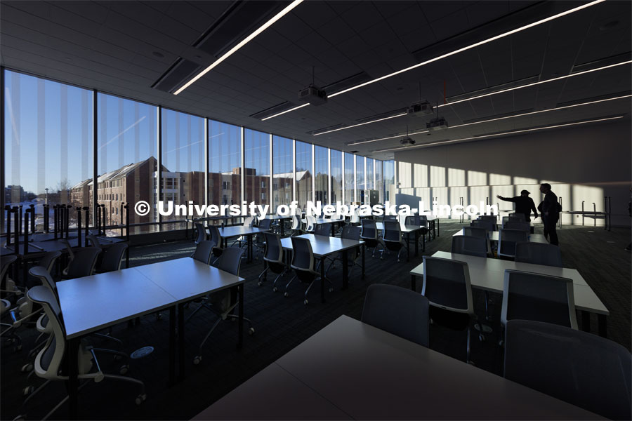 A large second floor lecture hall looks out over campus. Kiewit Hall. January 16, 2024. Photo by Craig Chandler / University Communication and Marketing.