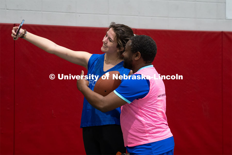 Professor Jean Marcel Ngoko Djiokap takes a selfie with University of Nebraska-Lincoln student Delaney Knight at Cook Pavilion Field. Nebraska’s Jean Marcel Ngoko Djiokap is taking physics lessons from the lectern to athletic fields to connect with students. February 9, 2024. Photo by Kirk Rangel / University Communication.
