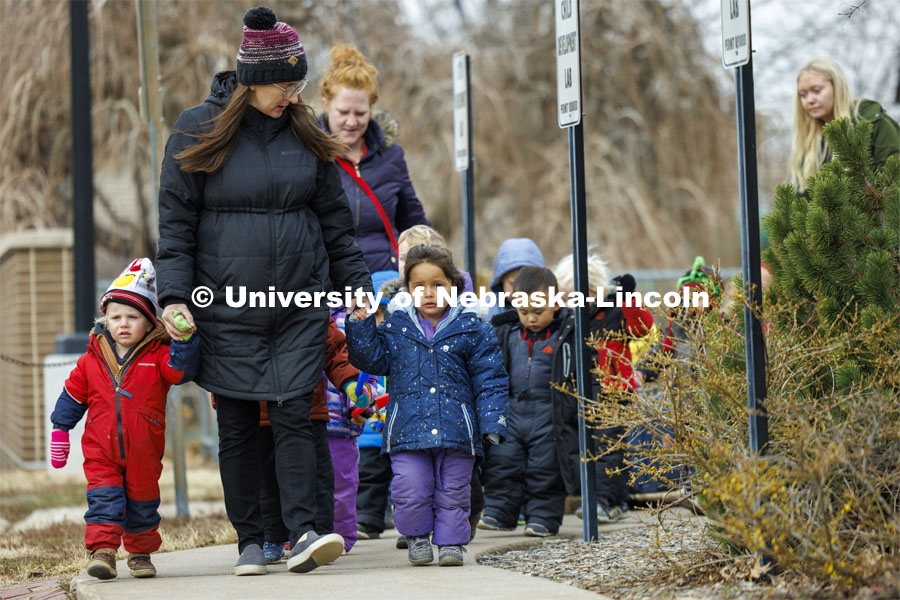 Mollie Von Kampen leads the children on a field trip. Students in the Ruth Staples Child Development Lab go on a field trip to the Nebraska East Union and a walk around campus. March 1, 2024. Photo by Craig Chandler / University Communication and Marketing.