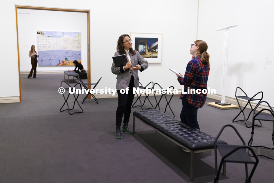Katie Anania talks with Sofie Curto as they study in the in the Unprecedented: Art in Times of Crisis exhibit space. Anania’s AHIS 381: Visualizing Crisis. Professors using the Sheldon Museum of Art as part of their classroom teaching. Photos for Nebraska Quarterly alumni magazine. March 7, 2024. Photo by Craig Chandler / University Communication and Marketing.
