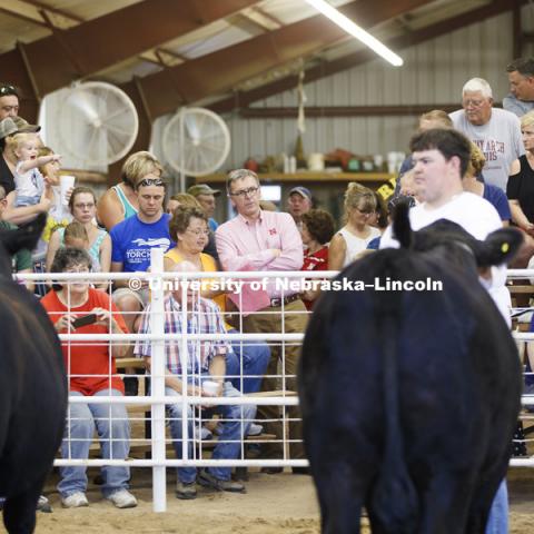 Chancellor Ronnie Green watches the Jefferson County Fair Junior Beef Show in Fairbury, Nebraska. July 13, 2018. Photo by Craig Chandler / University Communication.