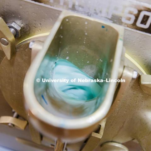 Shark Week ice cream mixes in the machine. Dairy Store making Shark Week ice cream with gummy sharks in a light blue ice cream. July 18, 2018. Photo by Craig Chandler / University Communication.