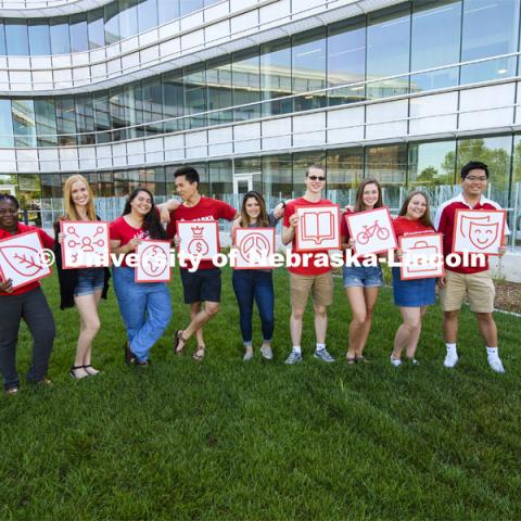 Students holding cards for the  Dimensions of Wellness program for Student Affairs. July 19, 2018. Photo by Greg Nathan, University Communication Photography.