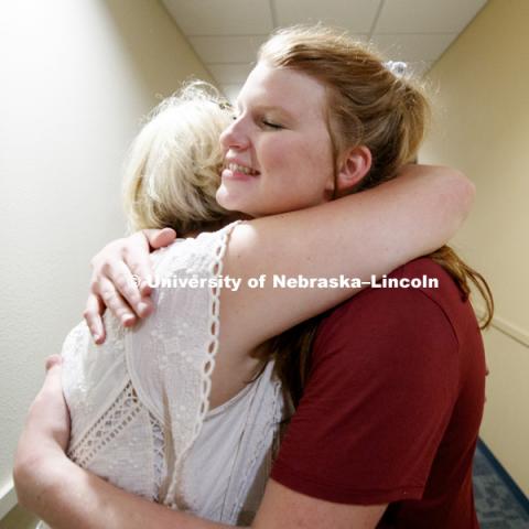 Grace Partridge of Rapid City, South Dakota, gives her mom, Katrina, a hug after moving into University Suites. Housing move in for sorority rush week. August 12, 2018. Photo by Craig Chandler / University Communication.