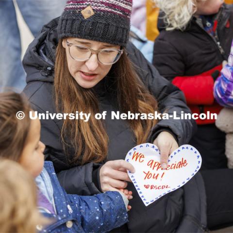 Mollie Von Kampen talks with the children as they prepare to give appreciation hearts to the food service workers in the Nebraska East Union. Students in the Ruth Staples Child Development Lab go on a field trip to the Nebraska East Union and a walk around campus. March 1, 2024. Photo by Craig Chandler / University Communication and Marketing.