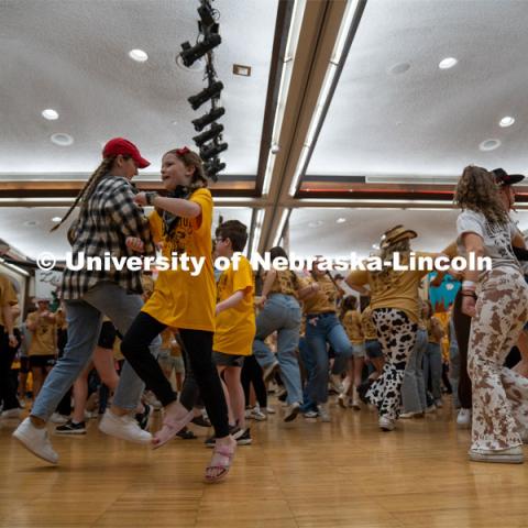 University of Nebraska-Lincoln students and miracle families swing dance at Dance Marathon. University of Nebraska–Lincoln students raised $83,702.24 during the annual HuskerThon. Also known as Dance Marathon, the event is part of a nationwide fundraiser supporting Children’s Miracle Network Hospitals. The annual event, which launched in 2006, is the largest student philanthropic event on campus. The mission of the event encourages participants to, “dance for those who can’t.” All funds collected by the Huskers benefit the Children’s Hospital and Medical Center in Omaha. March 2, 2024. Photo by Kirk Rangel.