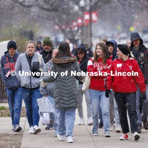 There is snow place like Nebraska as the afternoon tour groups walks through a snow flurry. Admitted Student Day is UNL’s in-person, on-campus event for all admitted students. March 23, 2024. Photo by Craig Chandler / University Communication and Marketing.