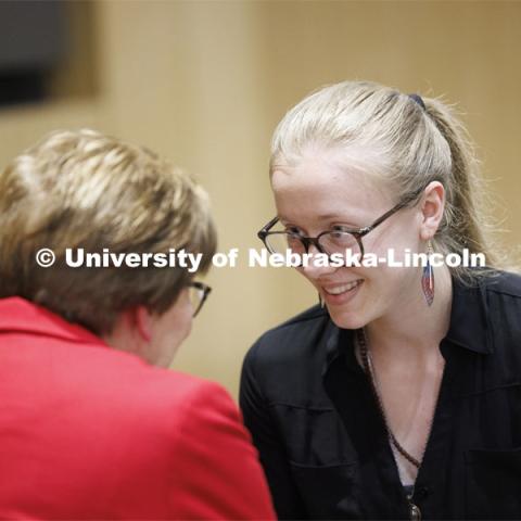 Aspiring teacher Jessica Brewer of Lincoln, Nebraska accepts her pin from CEHS 2024 alumni master Marilyn Moore. The second-year student has been admitted to the elementary education program in the College of Education and Human Sciences. April 5, 2024. Photo by Craig Chandler / University Communication and Marketing.