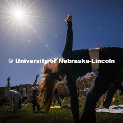 Yoga on the greenspace during the eclipse. The Solar Social party to view the partial solar eclipse filled the greenspace outside the Nebraska Union on City Campus. April 8, 2024. Photo by Craig Chandler / University Communication and Marketing.