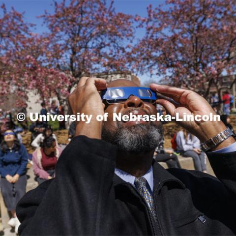Chancellor Rodney D. Bennett watches the eclipse. The Solar Social party to view the partial solar eclipse filled the greenspace outside the Nebraska Union on City Campus. April 8, 2024. Photo by Craig Chandler / University Communication and Marketing.