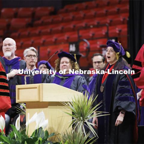 Professor Kristen Blankley performs the National Anthem. College of Law commencement in Devaney on the volleyball court. May 3, 2024. Photo by Craig Chandler / University Communication and Marketing.