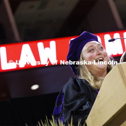 Murphy Cavanaugh gives remarks on behalf of the class of 2024. College of Law commencement in Devaney on the volleyball court. May 3, 2024. Photo by Craig Chandler / University Communication and Marketing.