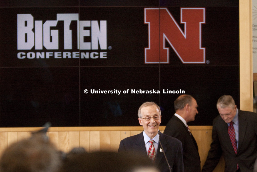 UNL Chancellor Harvey Perlman is all smiles as he discusses the Husker's new conference.  In the background, Big Ten Commissioner James Delaney and UNL's Tom Osborne chat. The University of Nebraska–Lincoln joined the Big Ten Conference today. Photo by Craig Chandler / University Communications