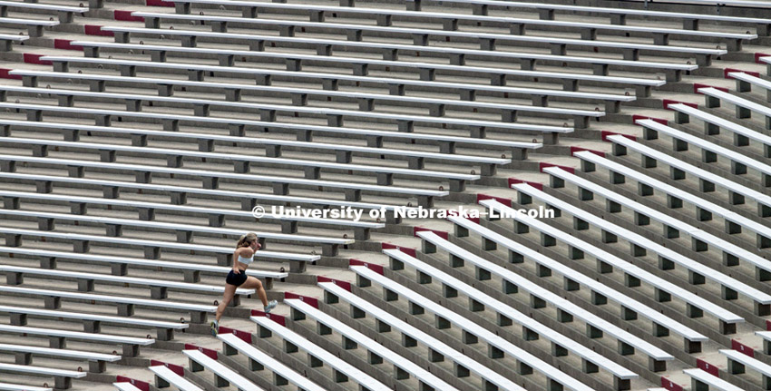 Athletes running stairs in Memorial Stadium, August 23, 2012.  Photo by Craig Chandler / University Communications