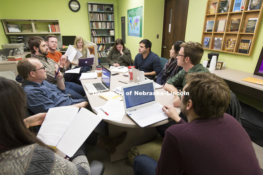 Ashley Strosnider working with staff to choose stories for the next issue of Prairie Schooner. February 23, 2015. Photo by Craig Chandler / University Communications.